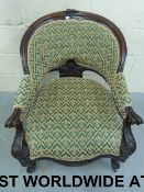 A 19thC carved mahogany armchair with fl