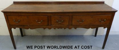 A George III two-plank oak dresser with