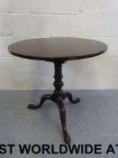 A 19thC circular mahogany tilt-top table