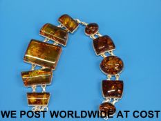 Two bracelets set with amber panels in w