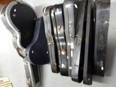 A quantity of various violin cases