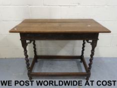 An oak side table with carved frieze, ra