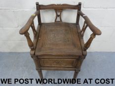 A carved oak commode (width 47cm, depth