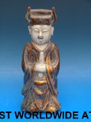 A Chinese figure of a scholar with brown