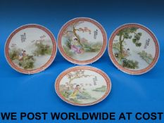 A set of four plates hand-decorated plat