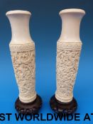 A pair of Chinese carved ivory vases on