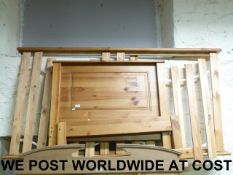 A pair of folding slatted chairs togethe