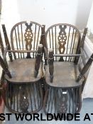 A set of four wheel back Windsor kitchen
