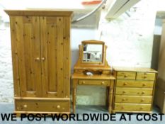 A pine bedroom suite comprising chest of