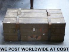 A vintage travelling trunk with leather
