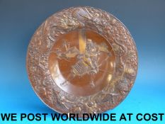 A Japanese Meiji period bronze plate wit