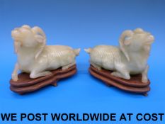 A pair of Chinese bowenite goats on wood