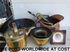 A large copper and brass coal scuttle wi