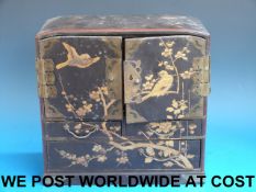 A lacquer jewellery cabinet with painted