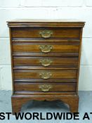 A late 19thC five drawer music cabinet w
