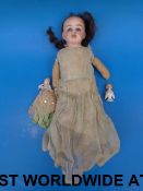 A 19thC bisque headed doll with open mou