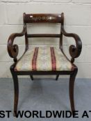 A Regency armchair with brass inlay