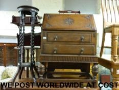 An oak bureau together with a barley twi