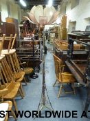 A brass and copper standard lamp in the