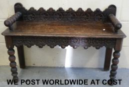 A 19thC carved oak hall seat (58cm high,