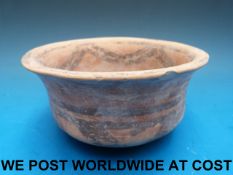 A Chinese Neolithic bowl with two small