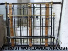A brass and iron bed (Approx 140cm wide)