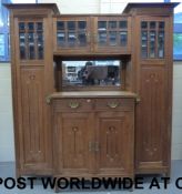 An Arts and Crafts oak breakfront dresse