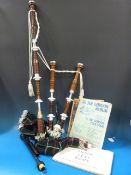 A set of rosewood bagpipes with leather