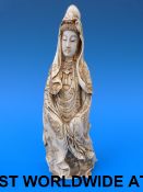 A Chinese ivory figure of Guanyin with i