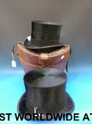 A leather cased top hat, the case marked