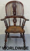 A 19thC elm seated Windsor armchair