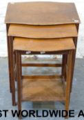 An oak nest of three tables by Waring &