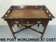 A 19thC mahogany buffet with shaped gall