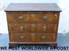 A Georgian walnut straight chest of draw