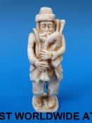 An European ivory figure of a bagpiper (
