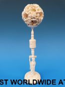 A Chinese ivory puzzle ball and stand