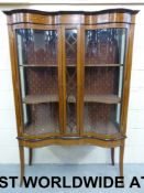 An Edwardian serpentine-fronted inlaid d