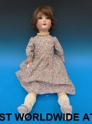 A Simon & Halbig bisque headed doll with