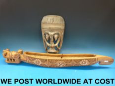 A tribal mask together with a dragon boa