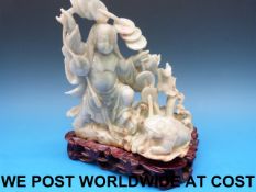 A Chinese jadeite carving of a female fi