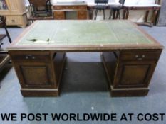 A mahogany leather inset partners desk,