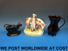 A Jackfield black cow creamer and tall j