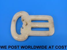 A Chinese jadeite belt buckle with carve