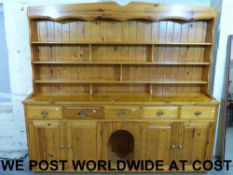A pine dog kennel dresser with plate rac