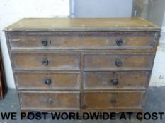 A large pine chest with one over six dra