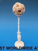 A Chinese ivory puzzle ball and stand
