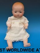 An Armand Marseille bisque headed doll w