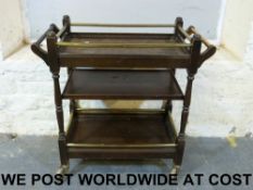 A mahogany three tier tea trolley