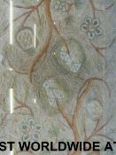 A framed needlework / embroidery of a sy