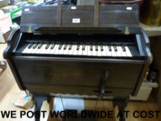A late 19thC portable harmonium